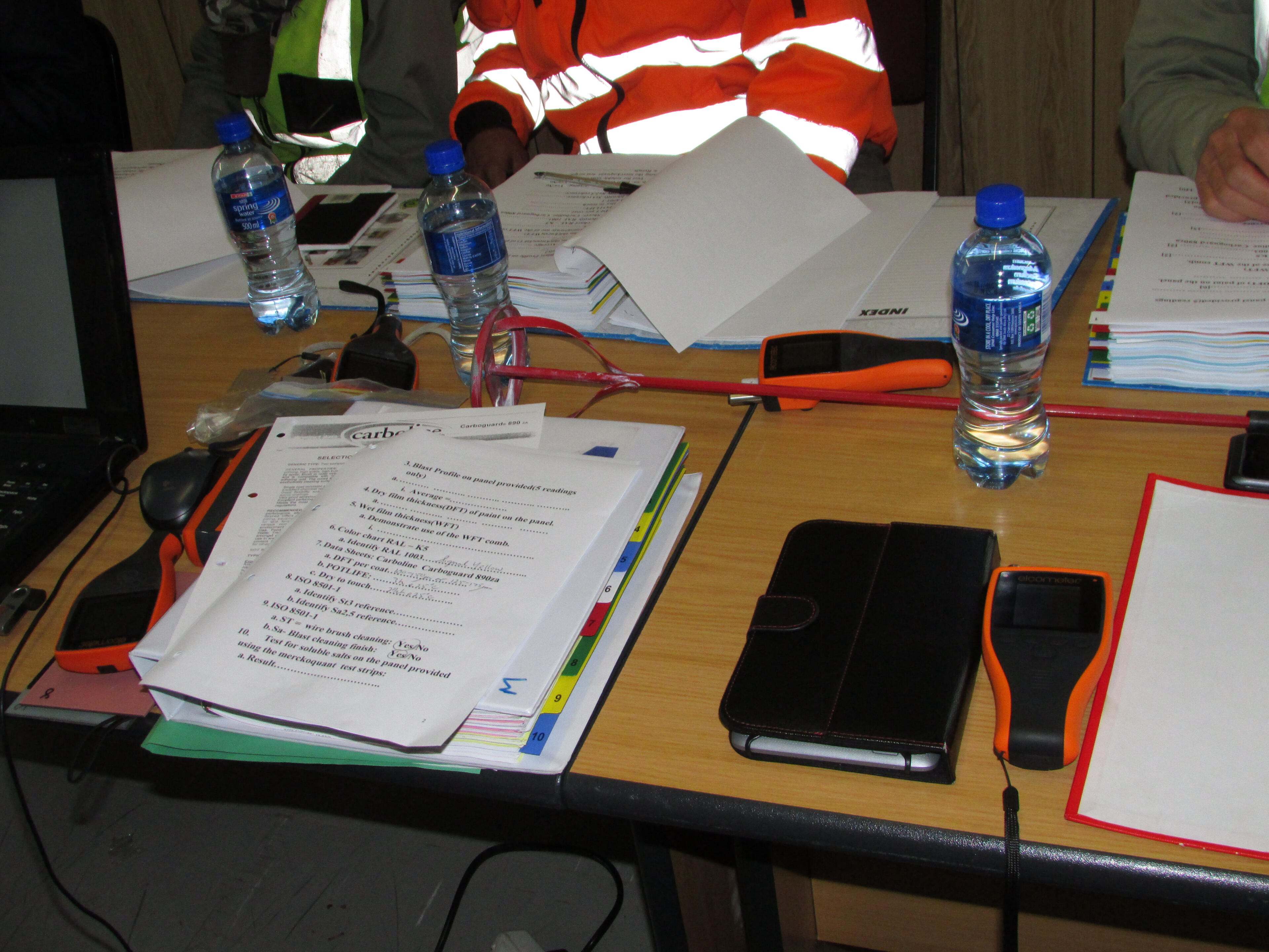 rsptrainingphoto Technicians reviewing course materials and inspection equipment during HRCSA theoretical training.